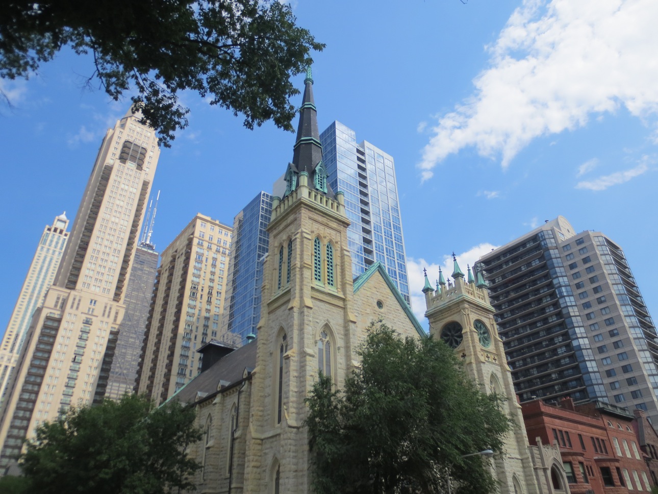 A church against the backdrop of skyscrapers.