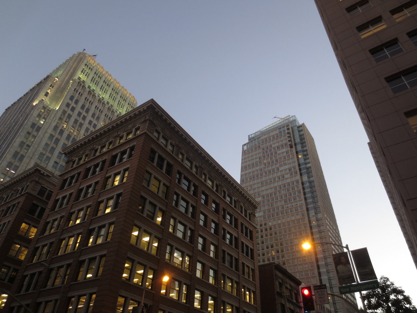 Looking up at downtown San Francisco buildings at dusk