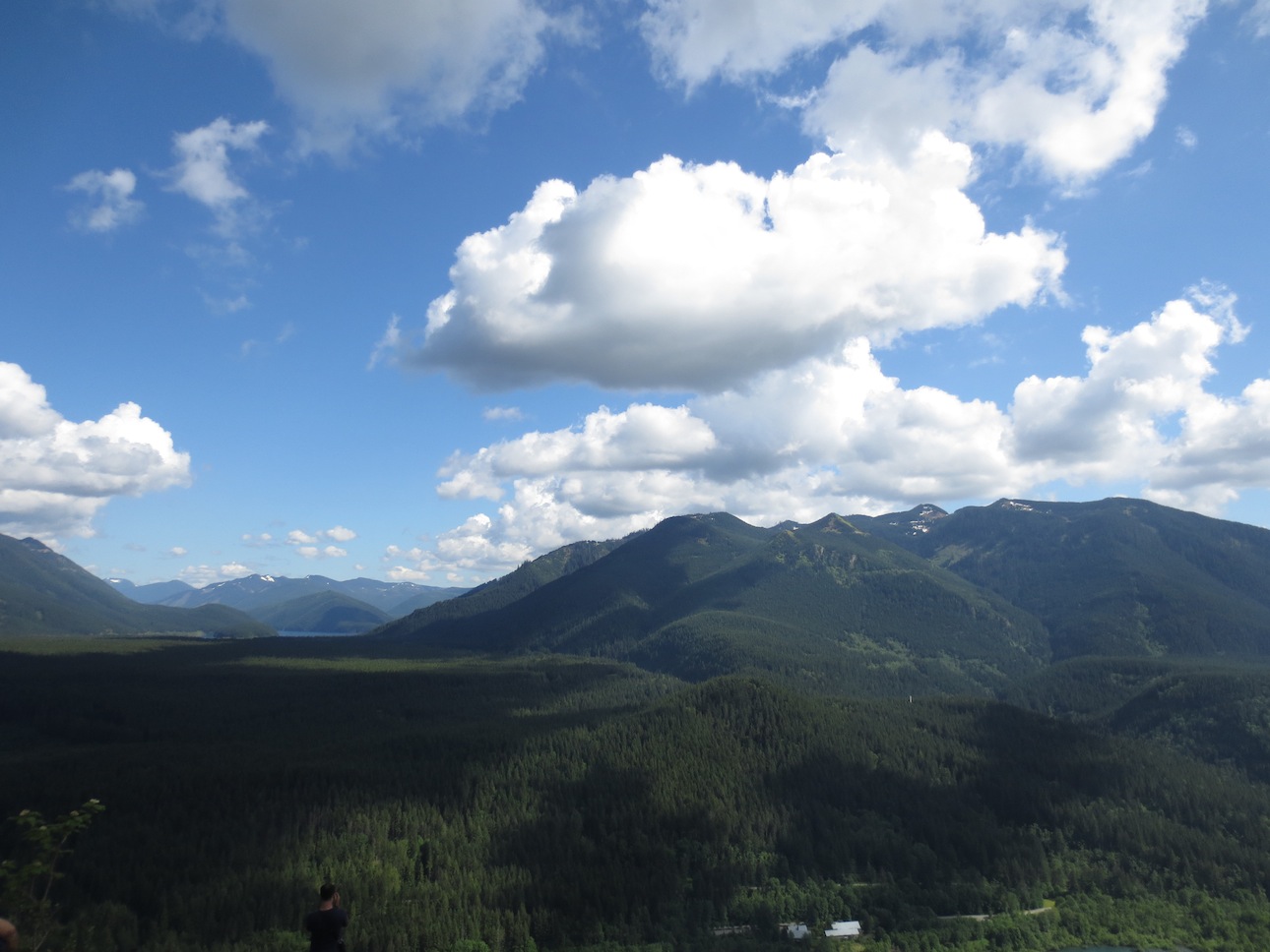 Clouds over the far mountains at the peak.