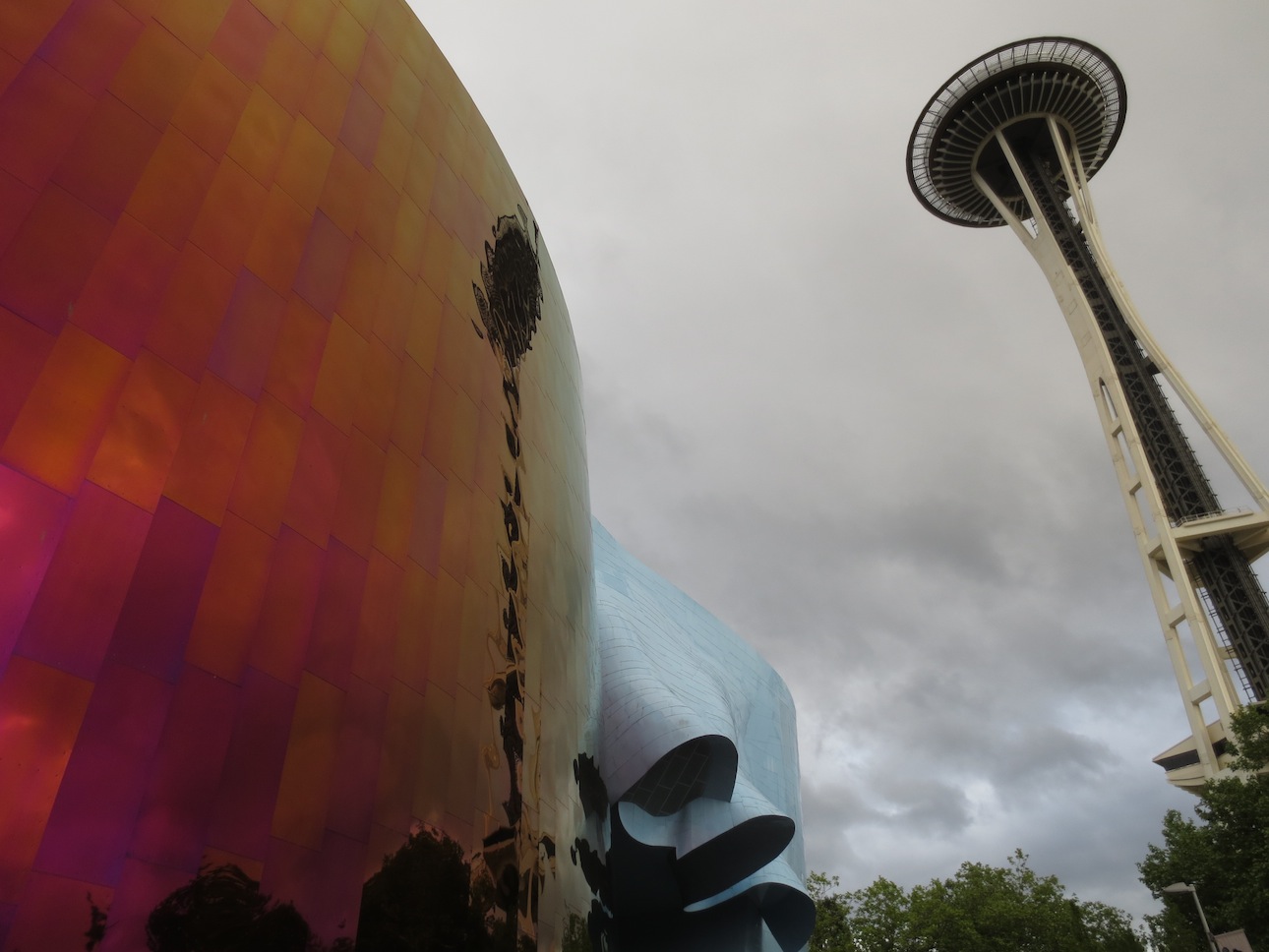 The Seattle Space Needle reflected against the Science Fiction museum.