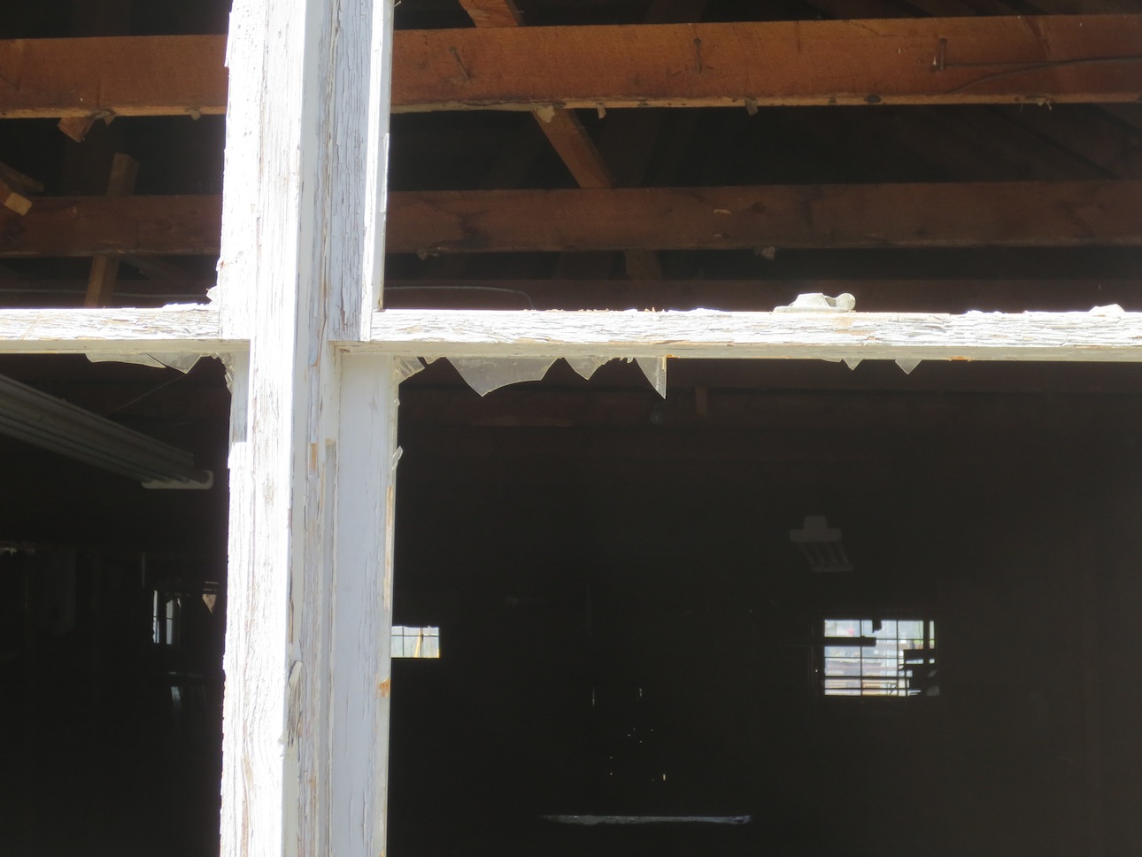 Broken windows in an empty building.