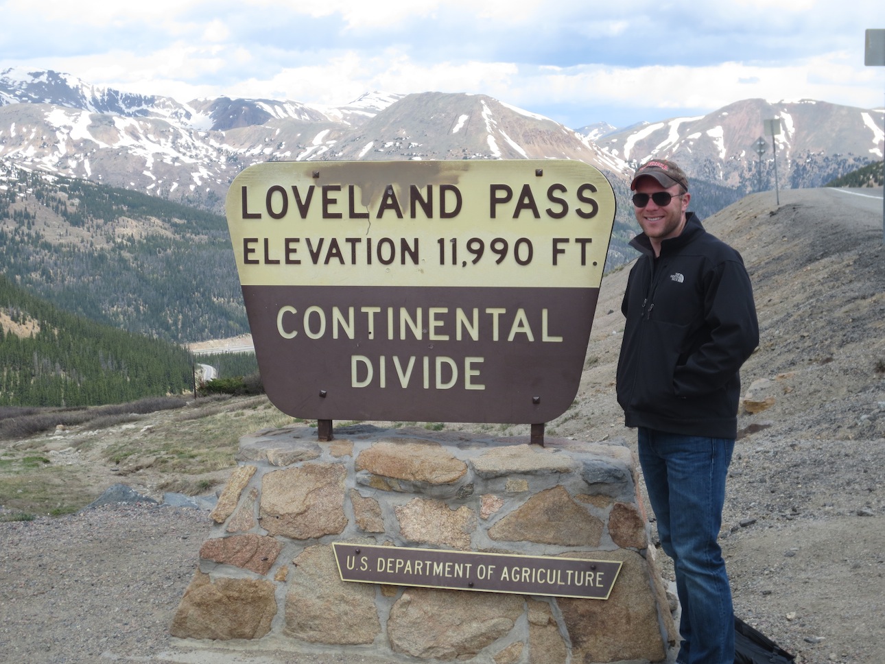 Matt Makai to the left of the Loveland Pass sign.