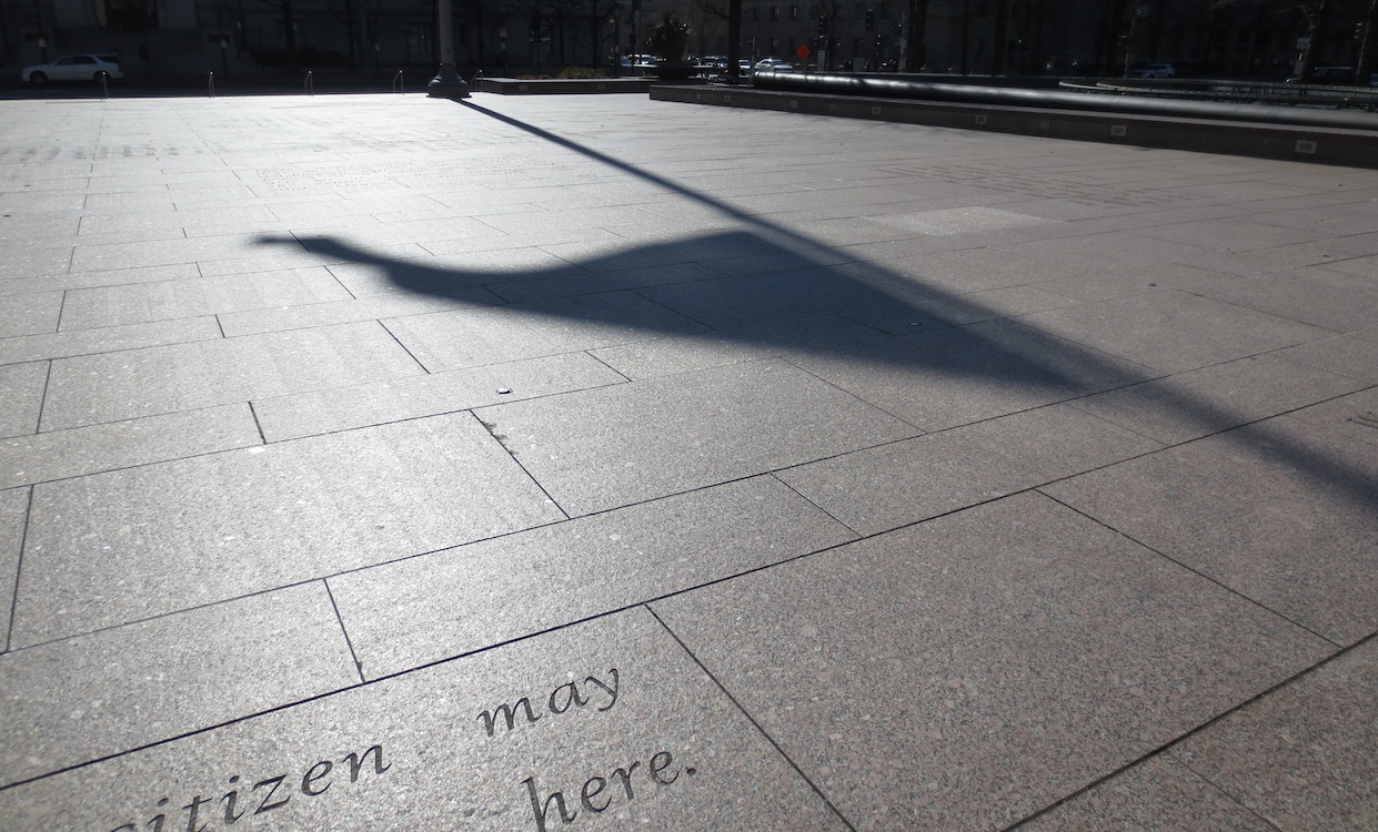 The shadow of a flag flying in Washington, DC.