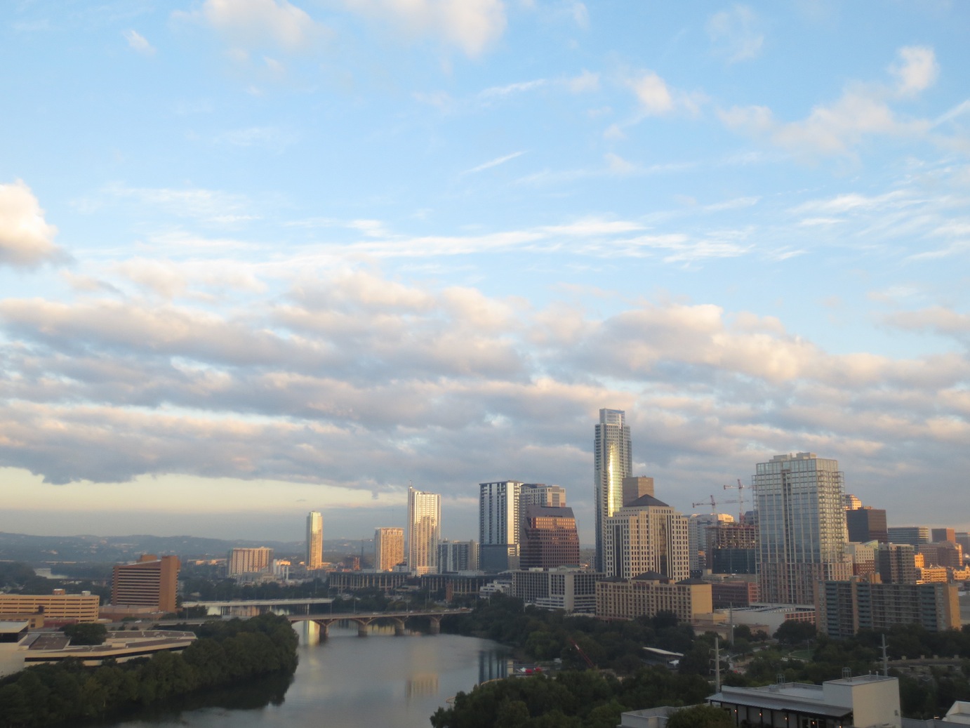 Another picture of the Colorado River and downtown skyline, at dusk.